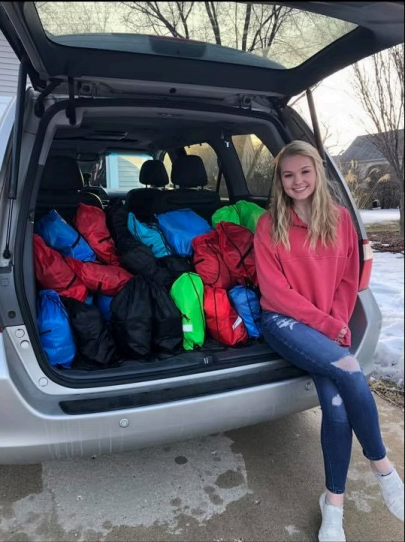 Vehicle loaded with donation bags for outreach